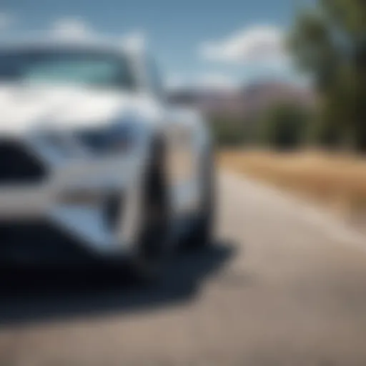 White Mustang parked under a clear blue sky