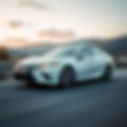 Dynamic shot of a Camry Hybrid on a scenic road